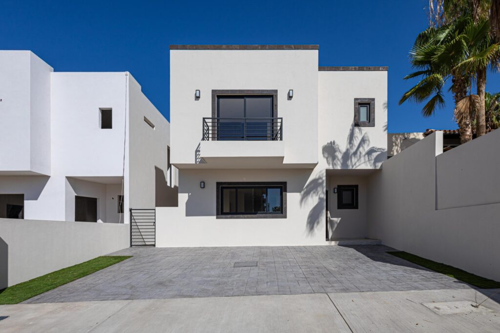 Cabo San Lucas Palma Real Pre-sale Palma Real is a quiet, peaceful, and private community, where you'll be able to find spacious and beautiful houses with 3 bedrooms, 2.5 bathrooms, 2 car parking, kitchen with granite counter top, closets, 10,000L water tank, and patio. Pool and common area, ideal to spend time with friends and family. Located near major shopping malls, banks, gas stations, cinema, and city center. Excellent investment opportunity due to its price and finishes. Upgrade: Synthetic Grass, Mini splits & Garage Pergola – Camino de la Duna, Cabo San Lucas, BS